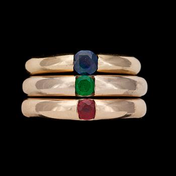 121. RINGS, 3, round cut ruby, emerald and blue sapphire.
