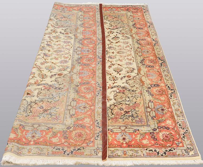 A carpet, Tabriz part silk, ca 302 x 200 cm.