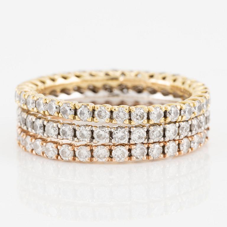 Rings, three pieces, set with brilliant-cut diamonds.
