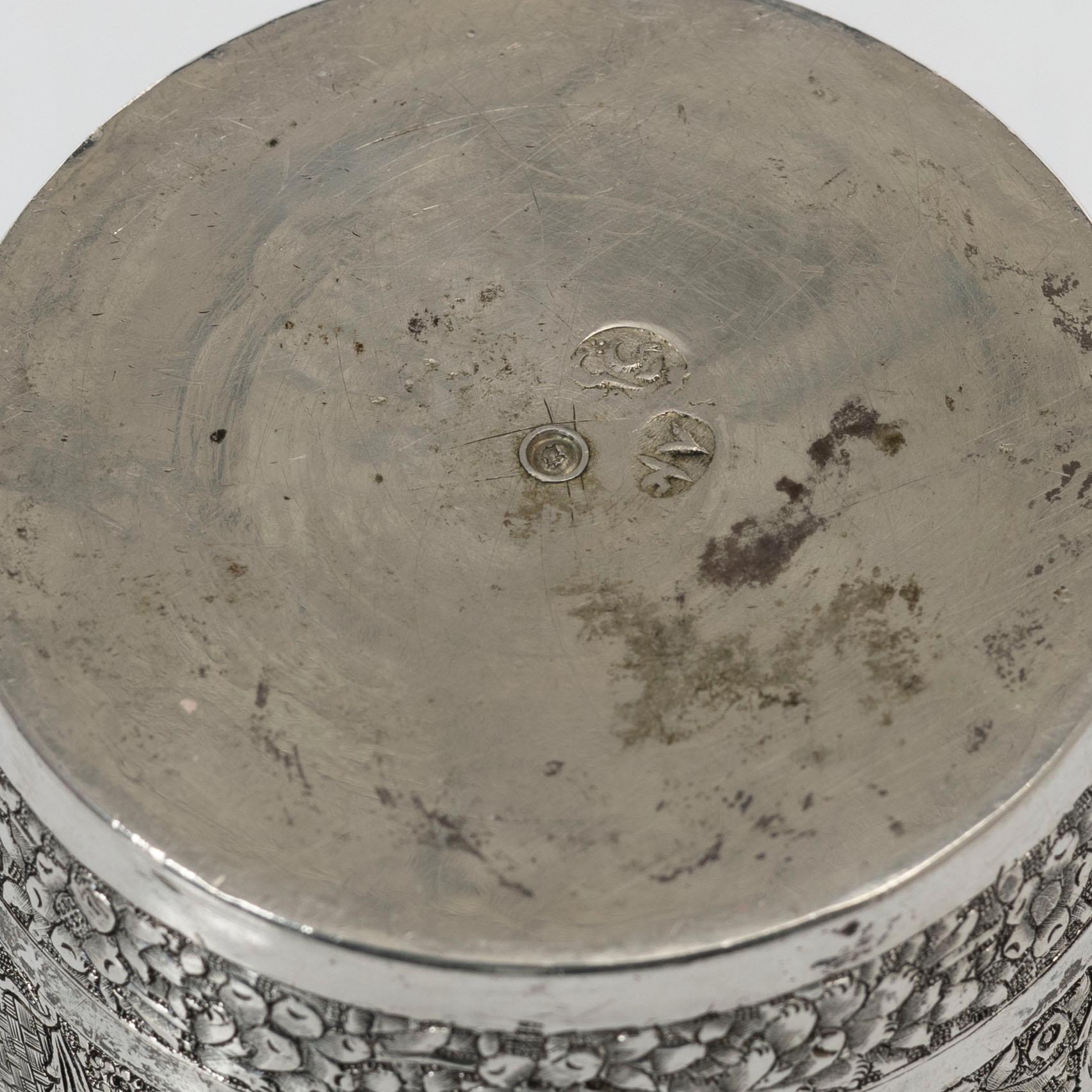 A Persian silver pitcher with five stemmed cups and a beaker, first part of the 1900s.