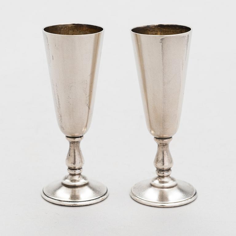 A set of six silver vodka cups, maker's mark of Vasily Kangin, Saint Petersburg, 1898-1903.