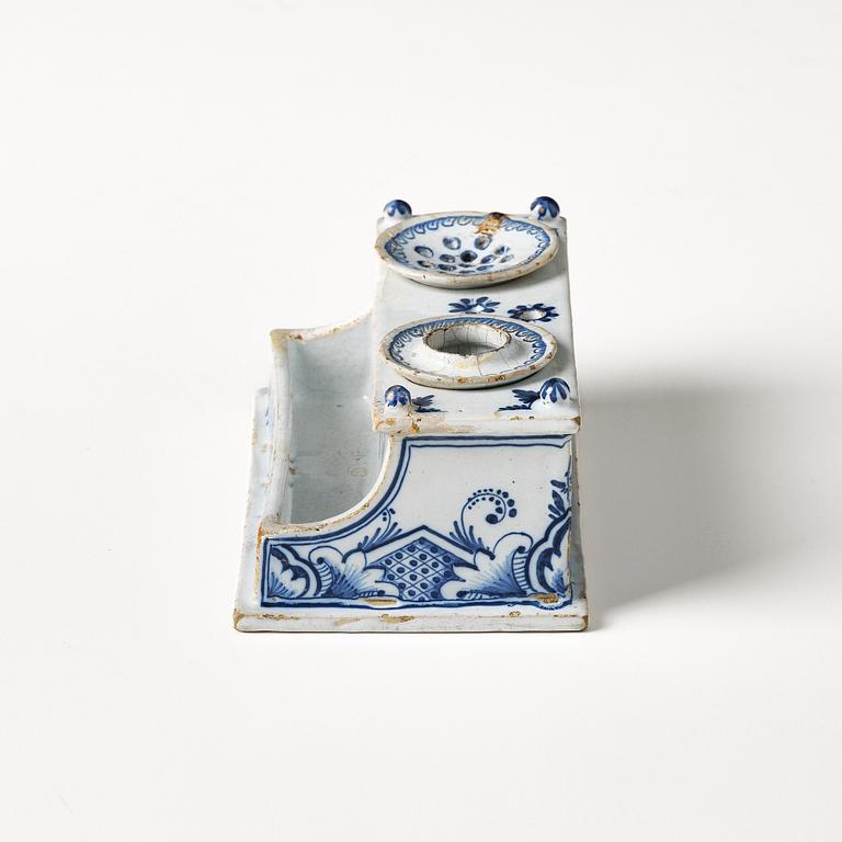 A Swedish Rörstrand faience desk set, dated Stockholm 22/11 1745.