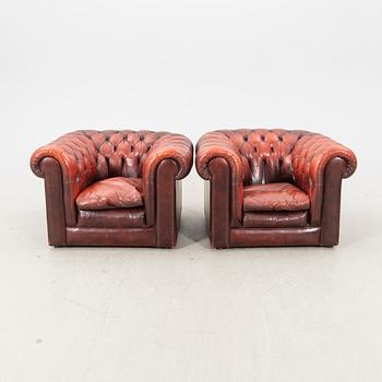 A pair of Chesterfield leather armchairs later part of the 20th century.