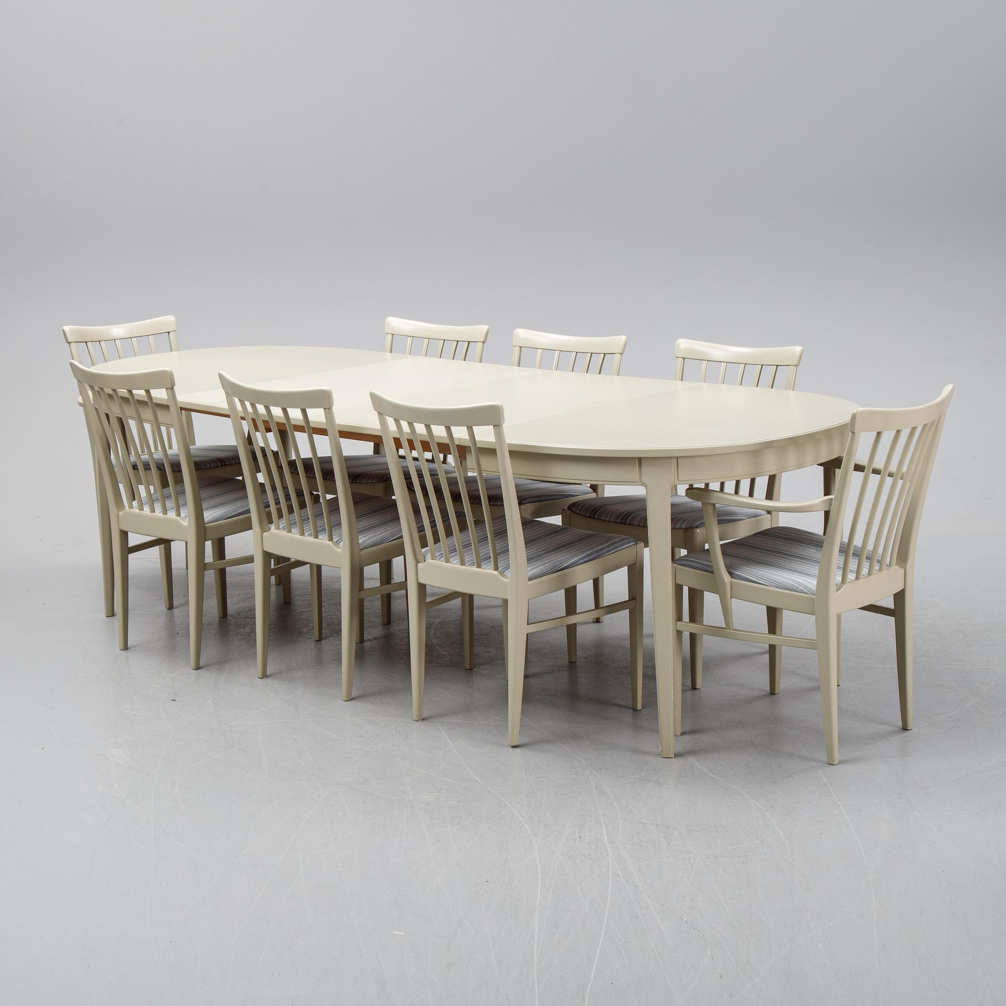 A dining table with two armchairs and six chairs by Carl Malmsten for Bodafors.