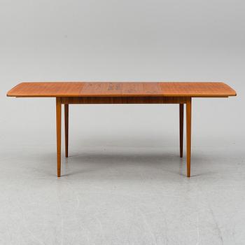 A second half of the 20th century teak veneered dining table.