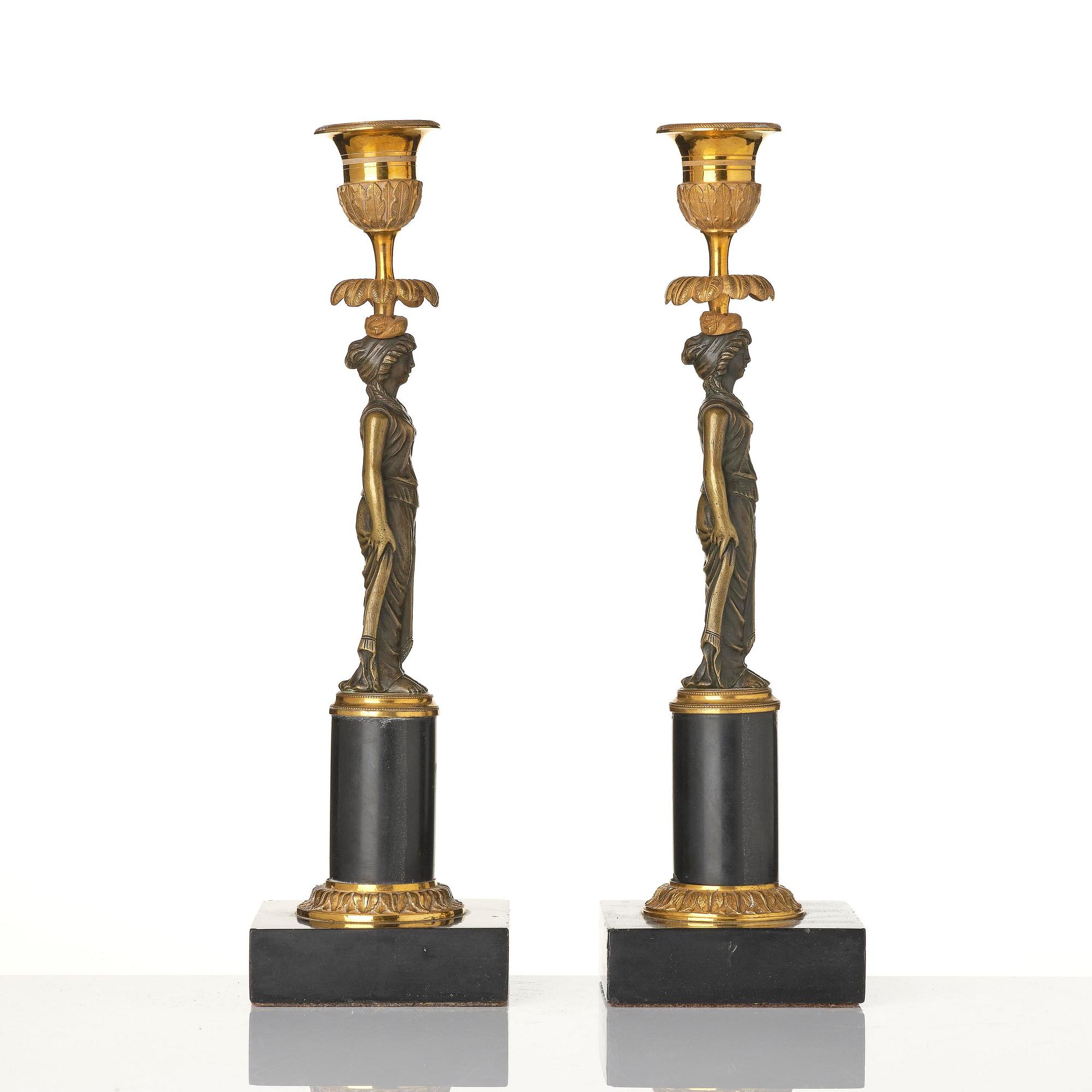 A pair of late Gustavian marble and ormolu candlesticks in the manner of F. L. Rung (1758-1837).
