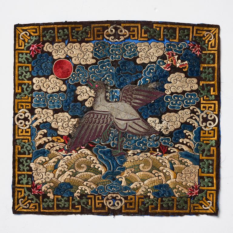 A pair of embroidered civil officials rank badges, Buzi, with egrets, Qing dynasty, 19th century.