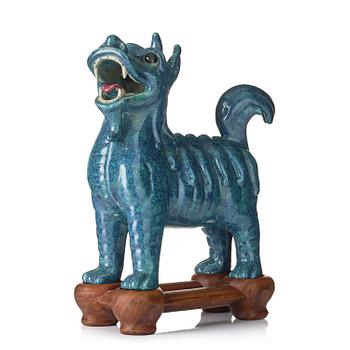 1312. A turquoise/robins egg glazed figure of a buddhist lion, Qing dynasty, Jiaqing (1796-1820).