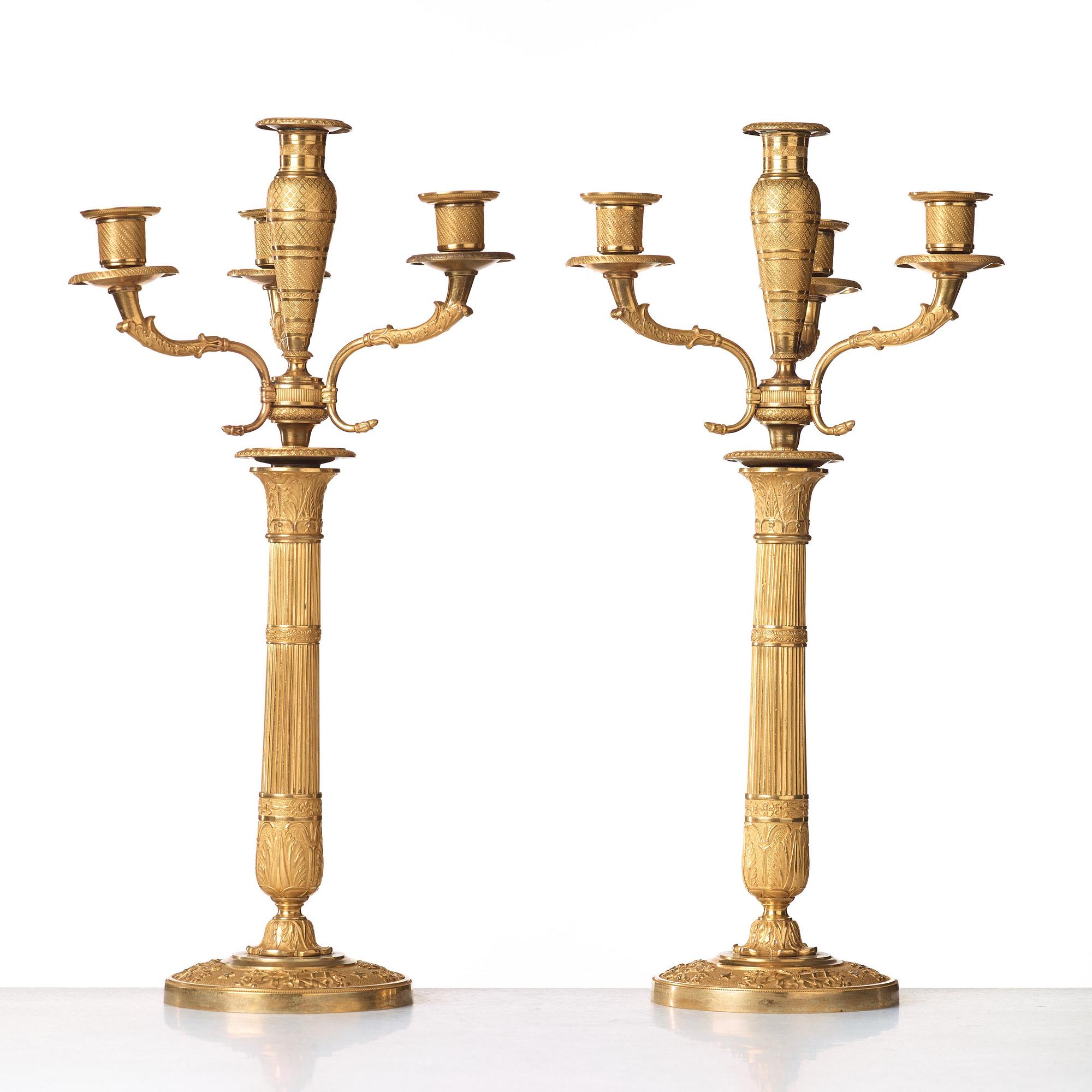A pair of Empire early 19th century gilt bronze four-light candelabra.
