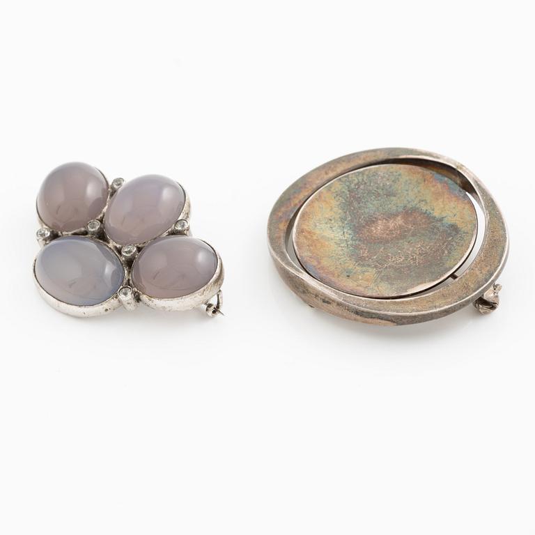 Two brooches, silver with chalcedony and white stones, SE Högberg, Gothenburg 1964 and H Strömdahl, Stockholm.