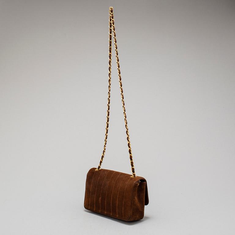 CHANEL, a suede hand bag.