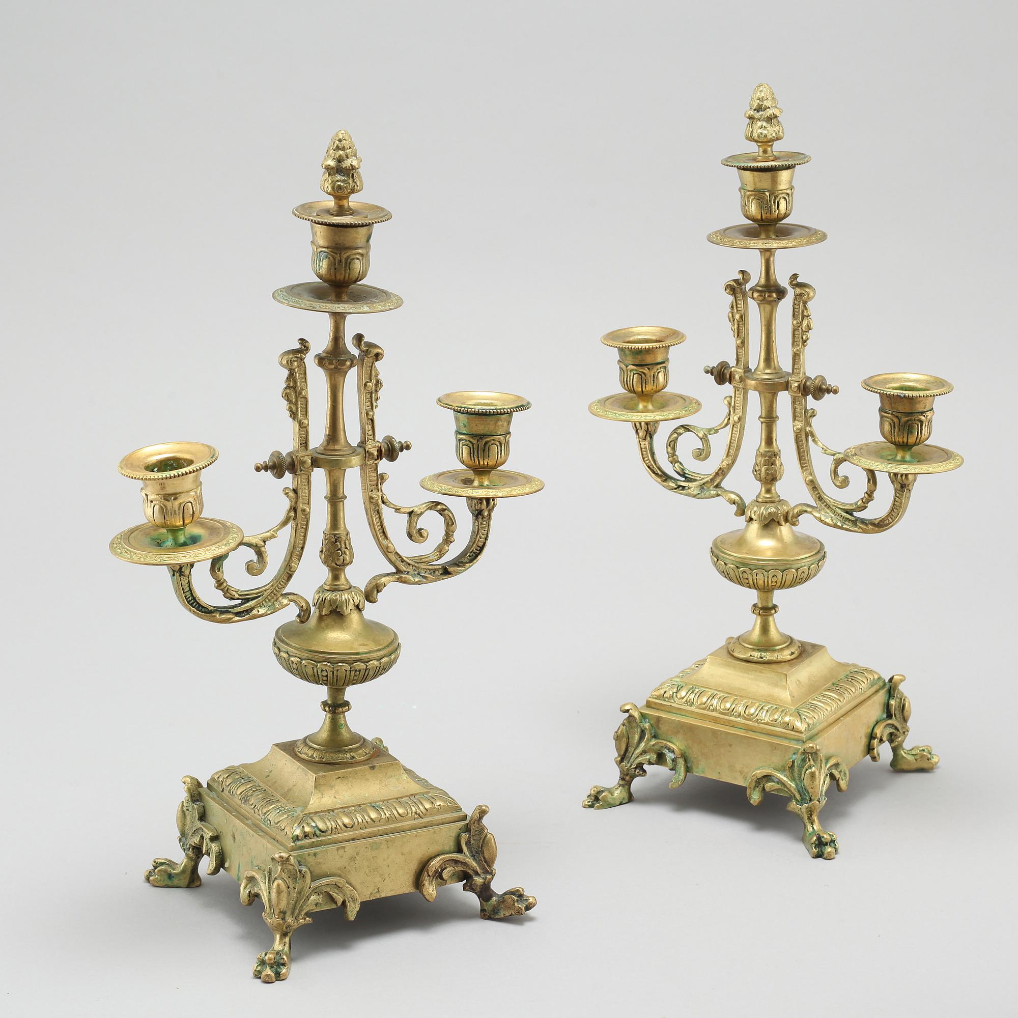 A table clock and two candelabras, around the year 1900.