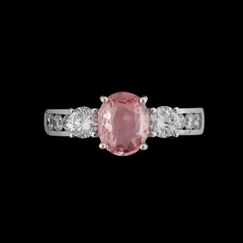 A pink sapphire, circa 1.55 cts, and diamond, total circa 0.7 ct, ring.