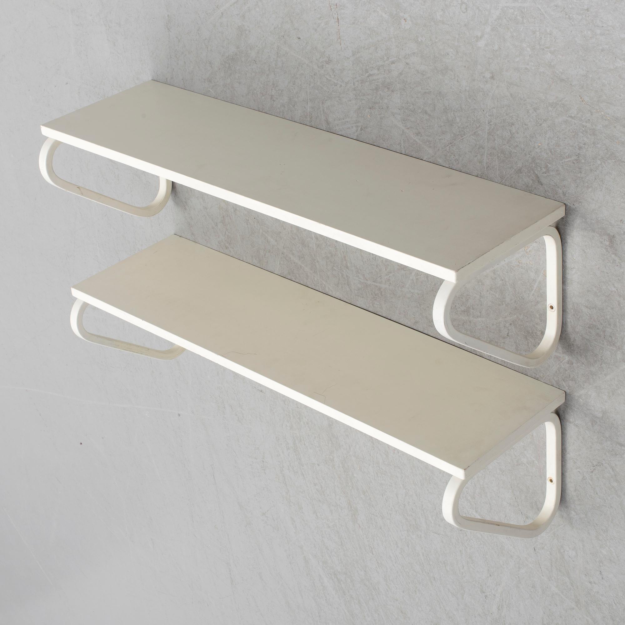 ALVAR AALTO, a pair of model 112 painted wall shelves from Artek, Finland.