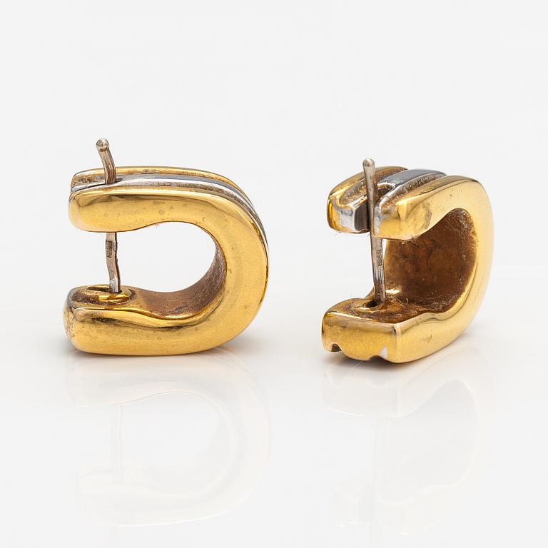 A pair of 14K gold earrings.