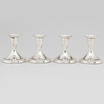 a set of four silver candlesticks by Tesi, Gothenburg 1967-1974.