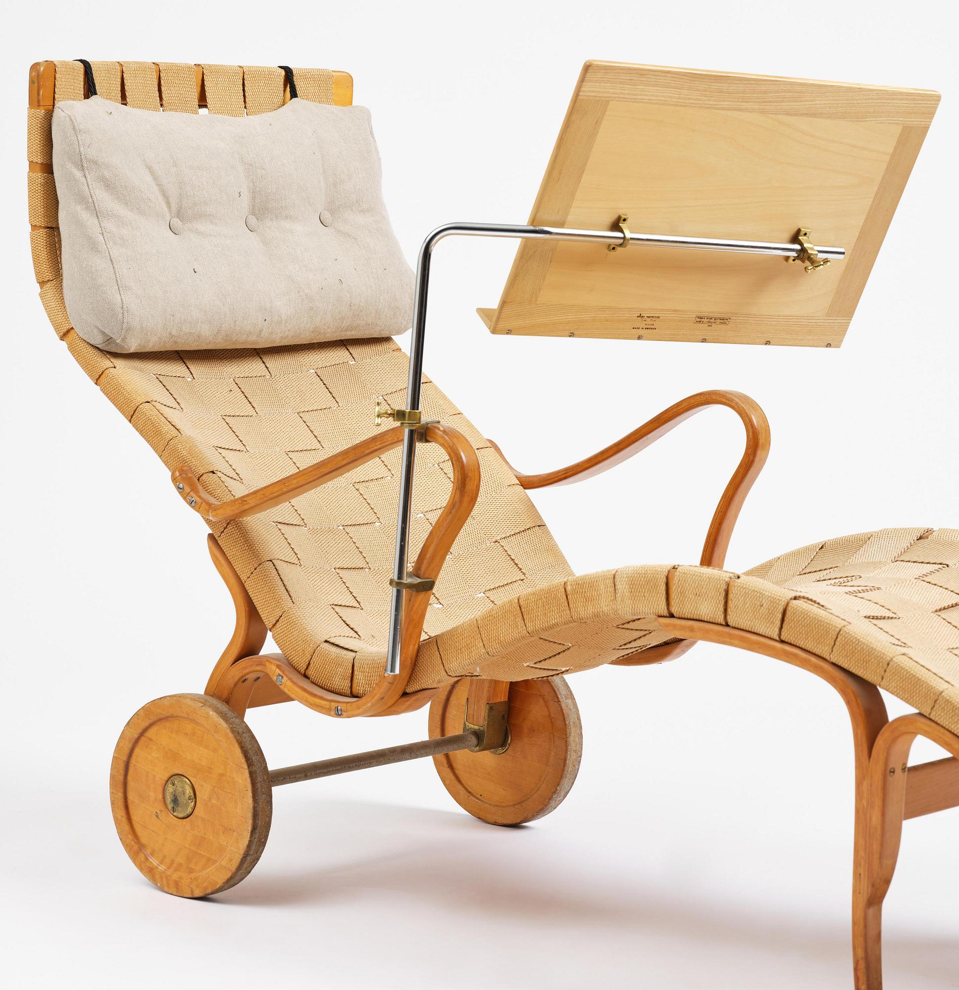 Bruno Mathsson, a lounge chair with wheels, Firma Karl Mathsson, Värnamo, 1940s, with reading table from 1972.