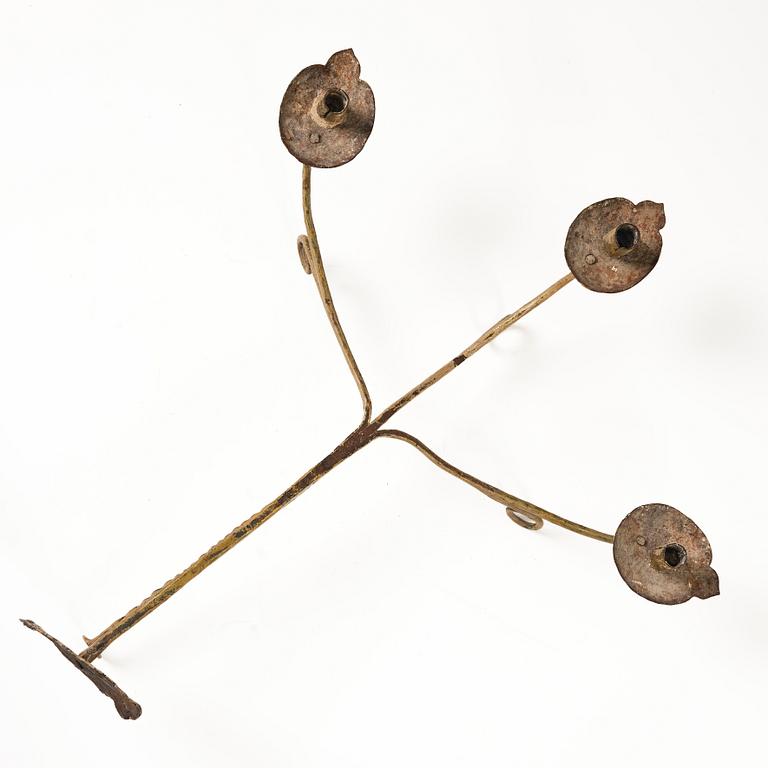 A Swedish wrought iron three-branch wall light, 17th / 18th century.