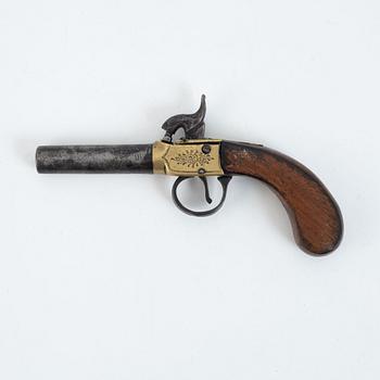 A 19th Century percussion pistol.