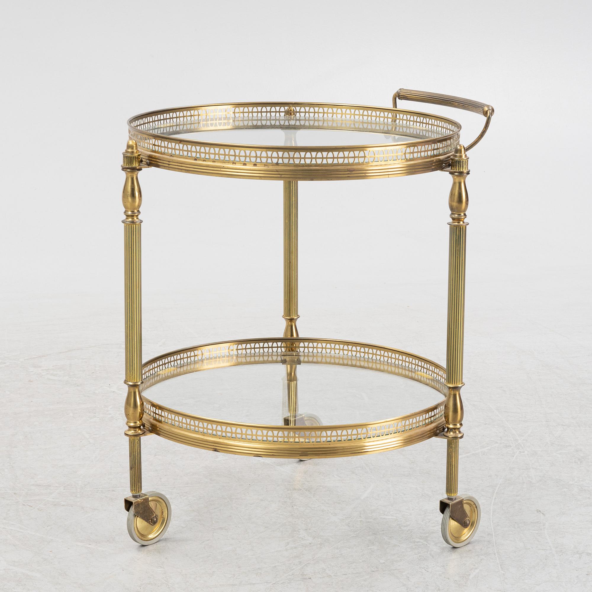 A glass and brass servin trolley, second part of the 20th Century.