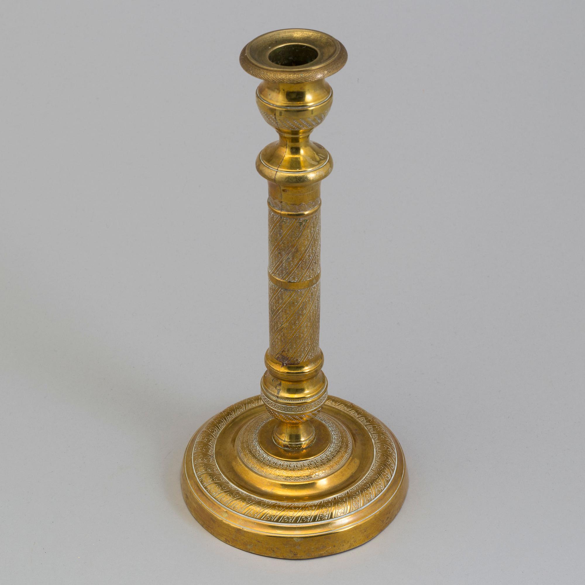 AN EMPIRE ORMOLU CANDLESTICK, first half of the 19th century.