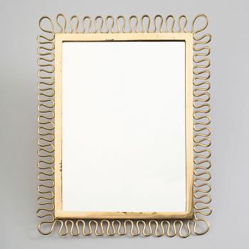 A first half of the 18th century brass mirror.