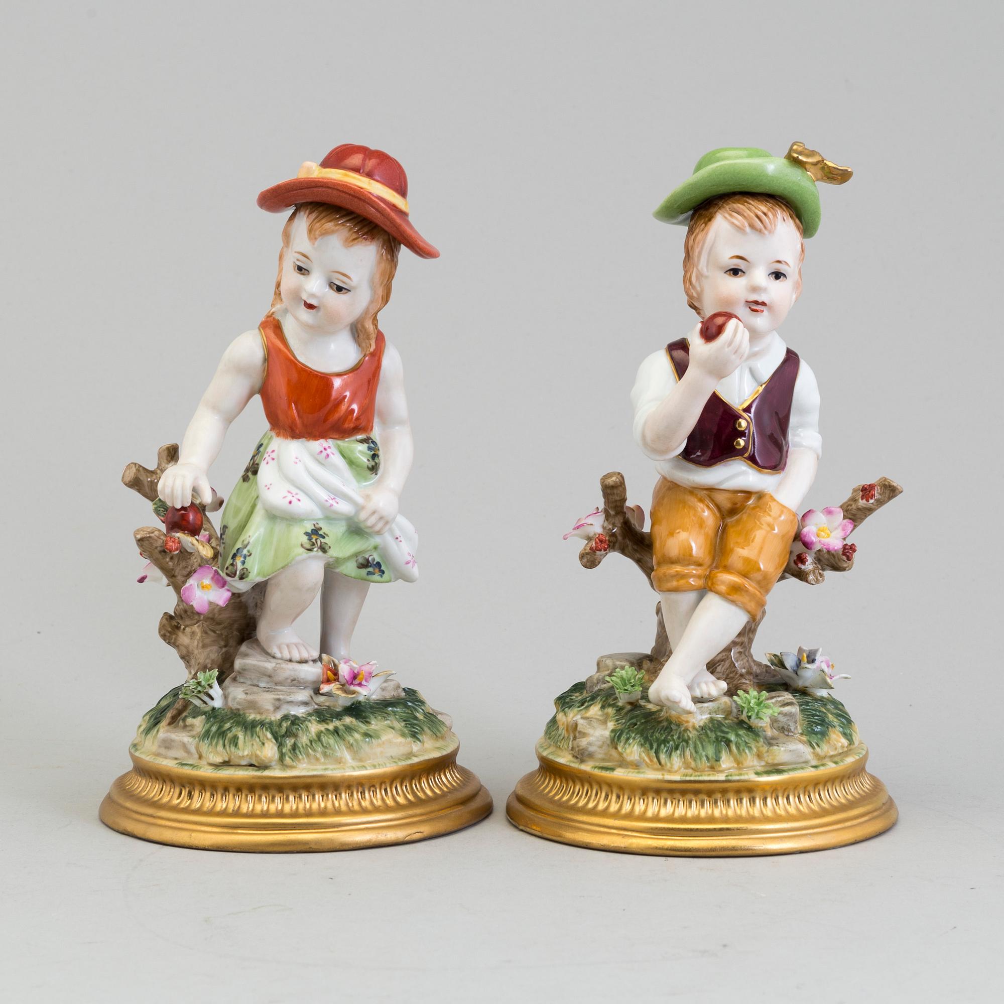 a pair of porcelain figurines marked similar to meissen, 20th century.