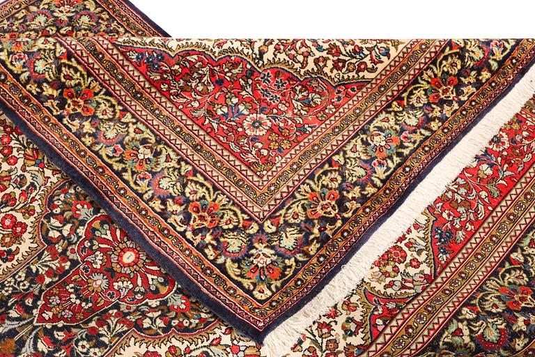 A Ghom rug, c. 202 x 137 cm.
