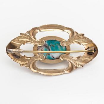 Elis Kauppi, A gilded silver brooch with a glass stone. Kupittaan kulta, Turku, 1940's.