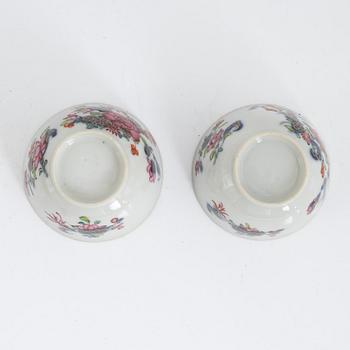 Twelve Chinese famille rose cups on stands, Qing dynasty, Qianlong (1736-95).