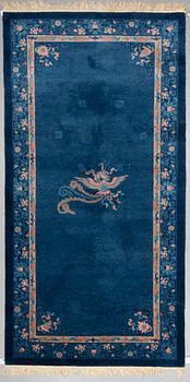 A CARPET, an old China, ca 295 x 153 cm (as well as 2 cm flat weave at the ends).