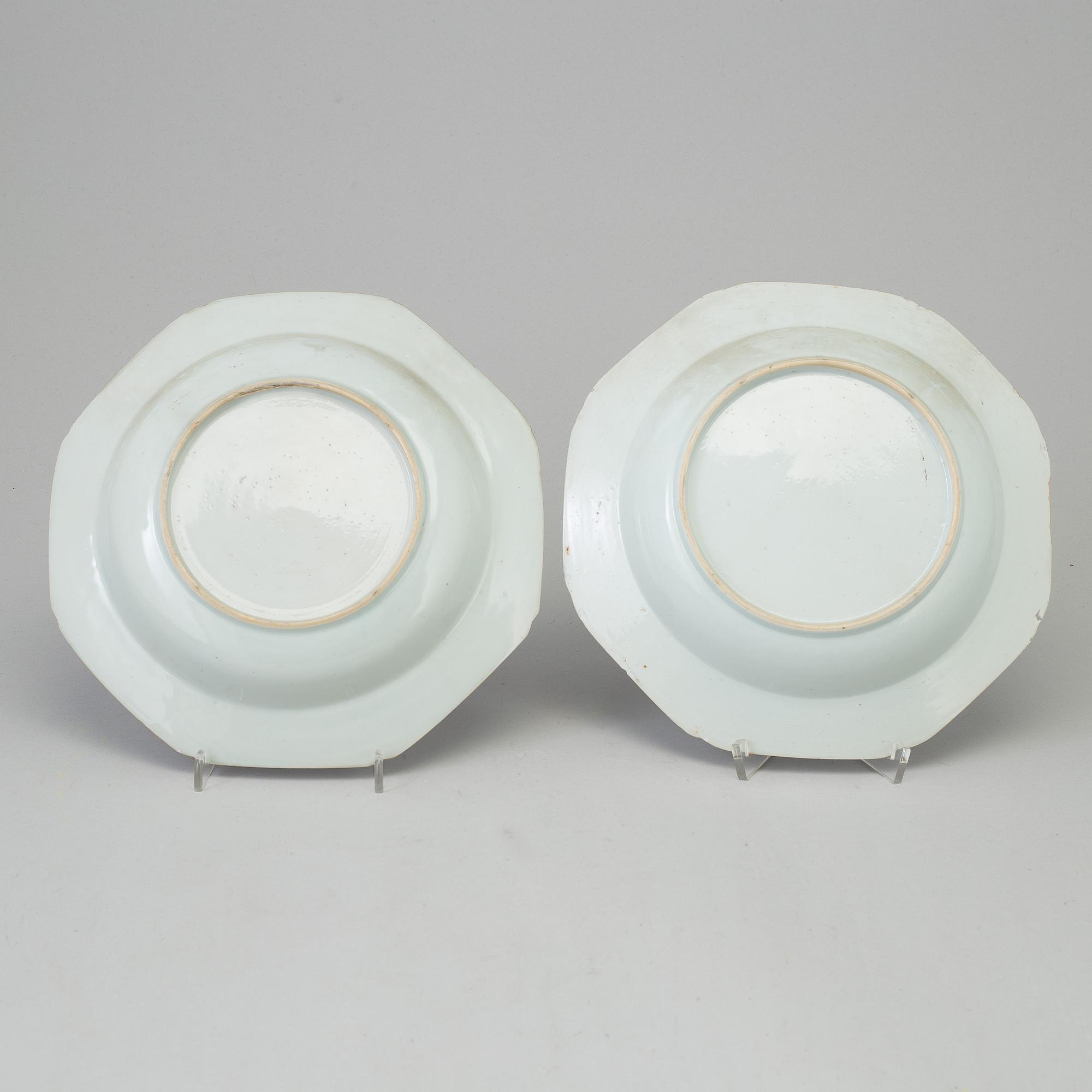 Two blue and white dishes and two cups with dishes, Qing dynasty, Qianlong (1736-95) and Kangxi (1662-1722).