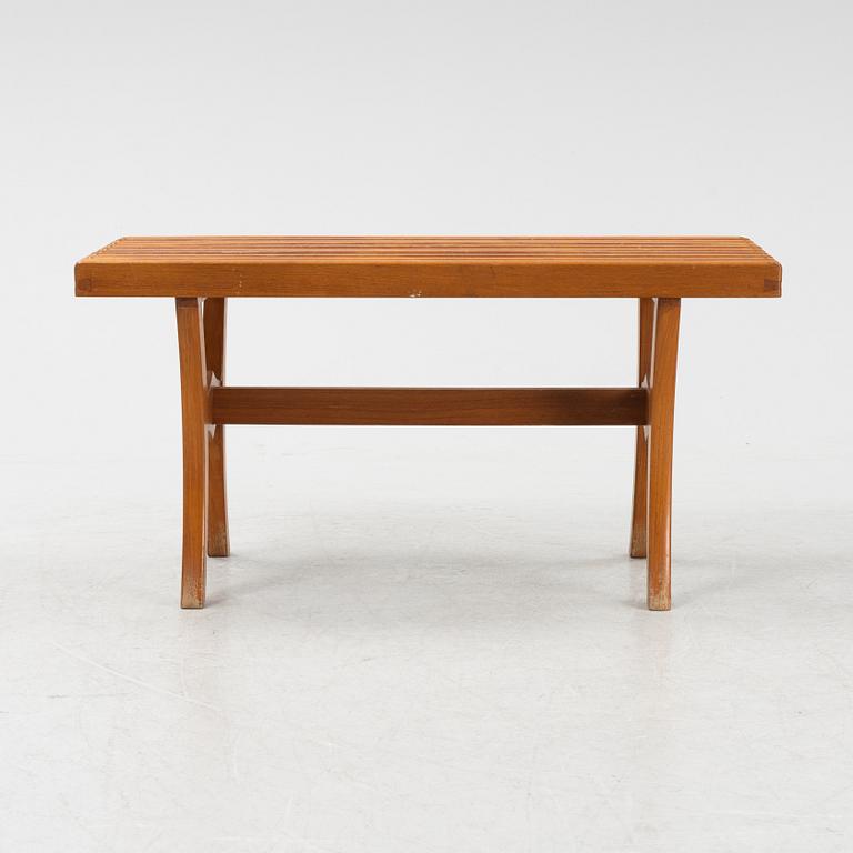 A stained-wood bench, later part of the 20th Century.