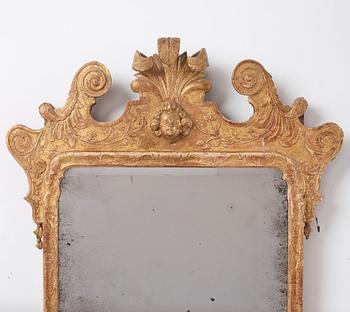 A Northern-European late Baroque two-light giltwood mirror sconce, first part of the 18th century.