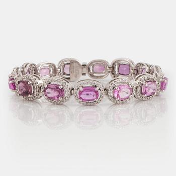 960. An 18K white gold bracelet set with faceted pink sapphires and round brilliant-cut diamonds.