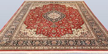 A silk Ghom carpet, c. 346 x 247 cm.