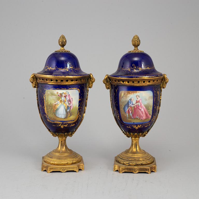 A pair of French blue enamelled vases with covers, 20th century.