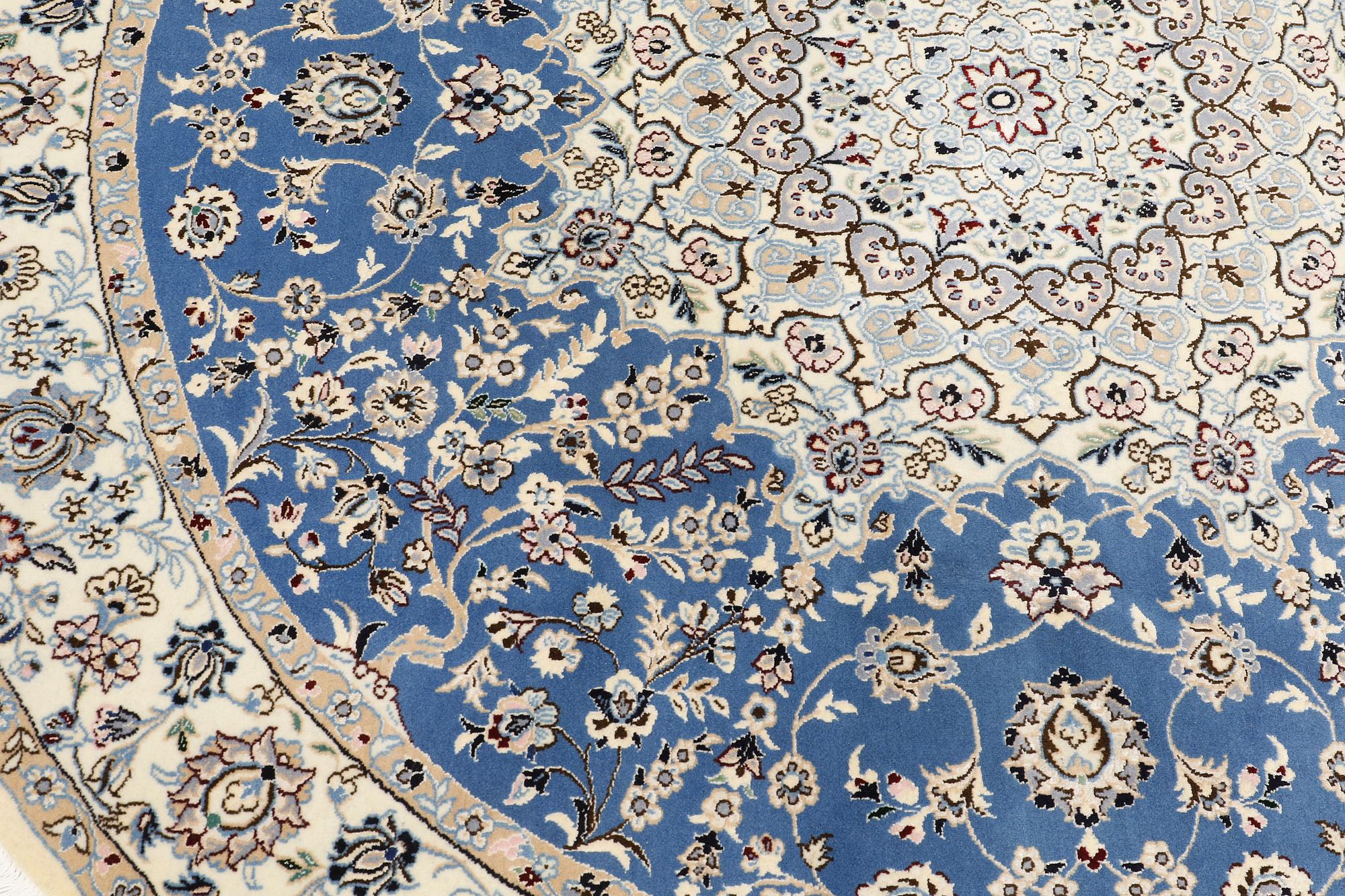 A round part silk Nain rug, so called 9 LAA, diameter 195 cm.