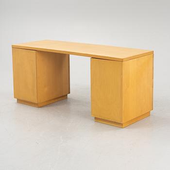 Alvar Aalto, a birch writing desk for Artek, Finland, second half of the 20th century.