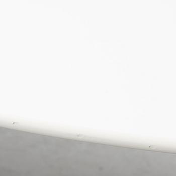 Vico Magistretti, a "Shine" dining table with twelve chairs, De Padova, Italy, around the year 2000.