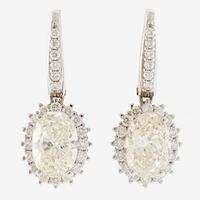 Örhängen 18K vitguld med ovalslipade diamanter, medföljande GIA report.