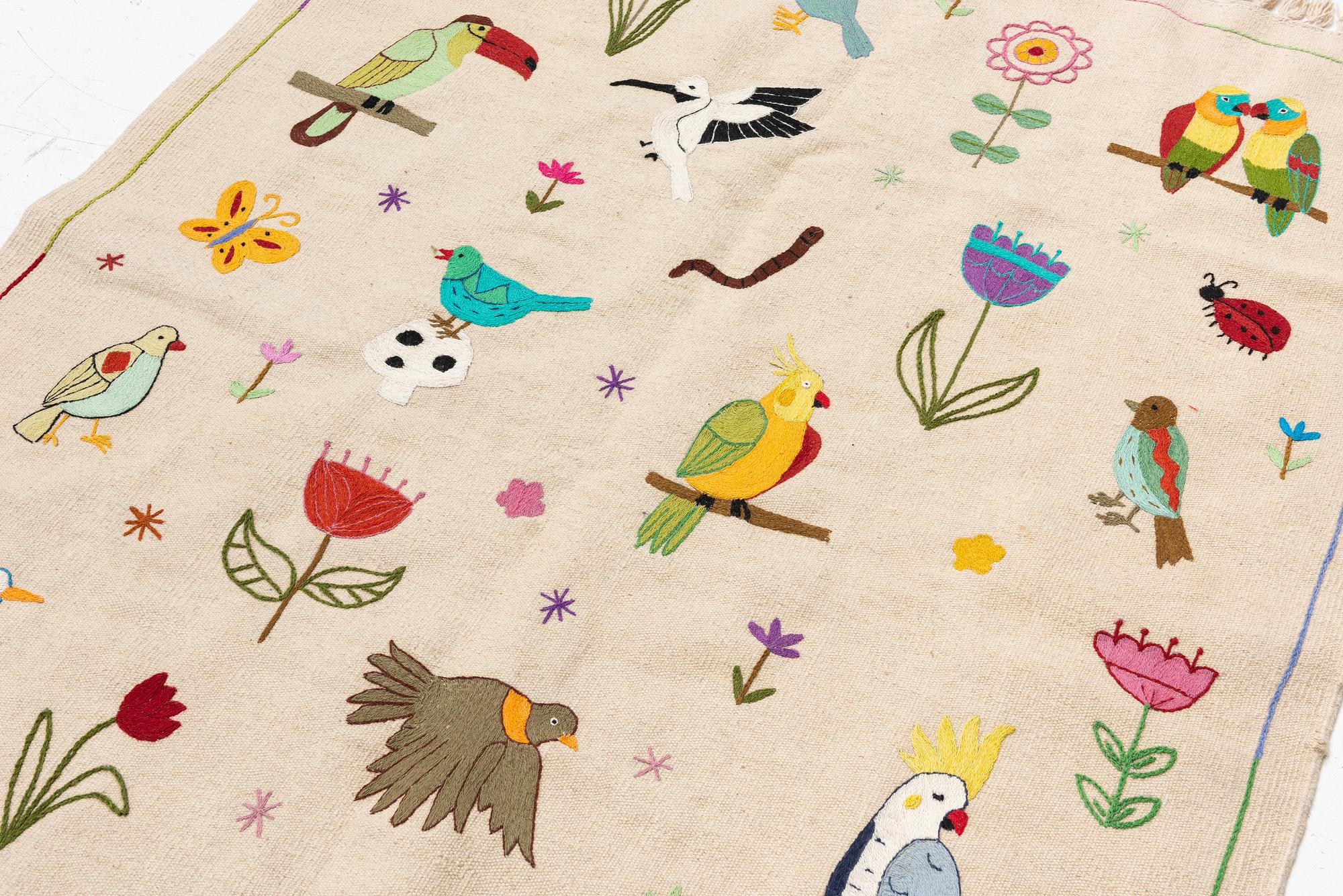 A hand-embroidered Kelim carpet, c. 200 x 145 cm.