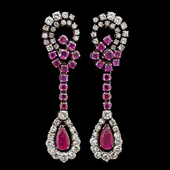 82. A pair of ruby and brilliant cut diamond earrings, tot. app. 1.80 cts.