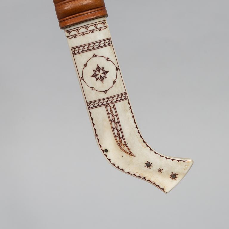 Esse Poggats, a reindeer horn knife, signed.