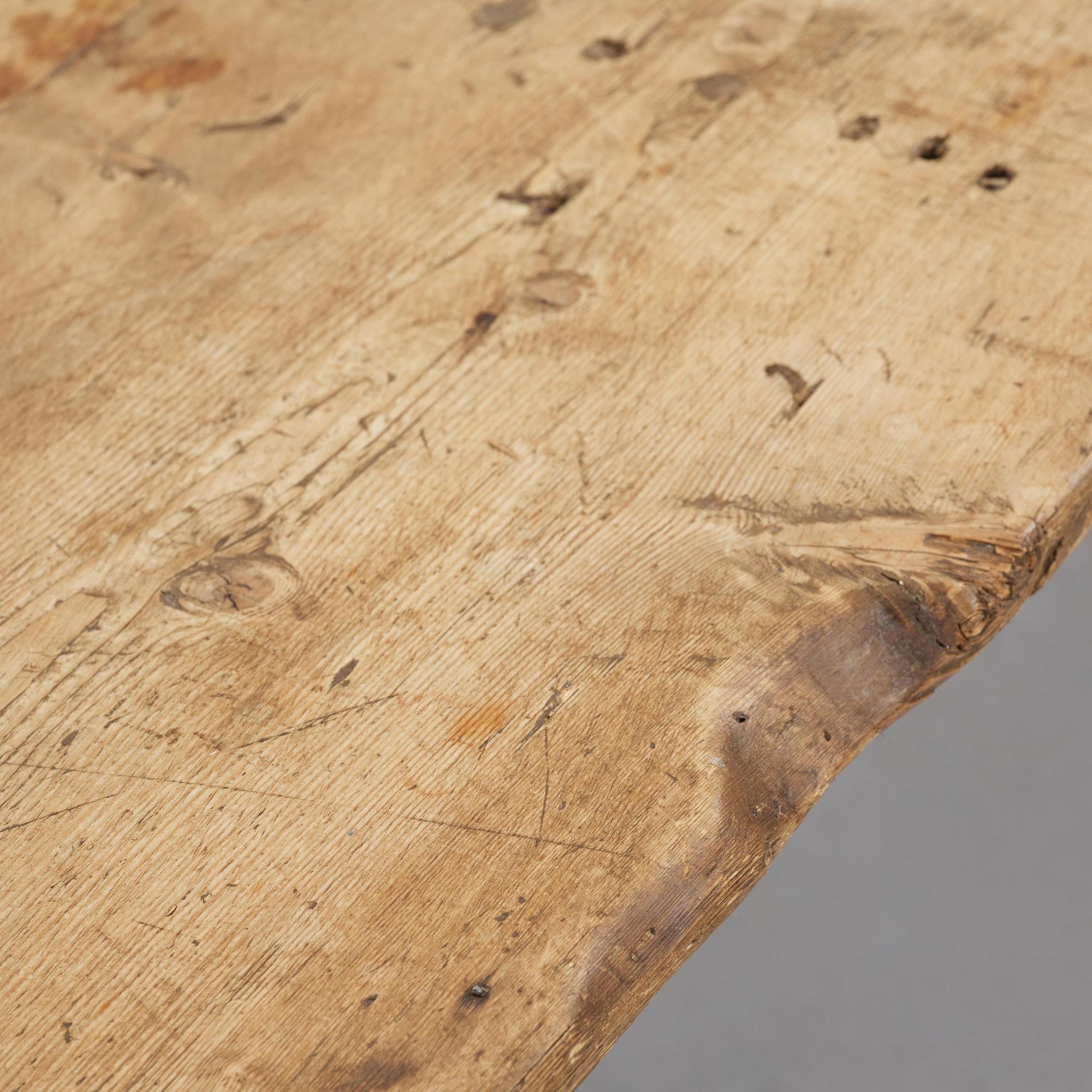 A pine trestle table, 20th century incorporating older elements.