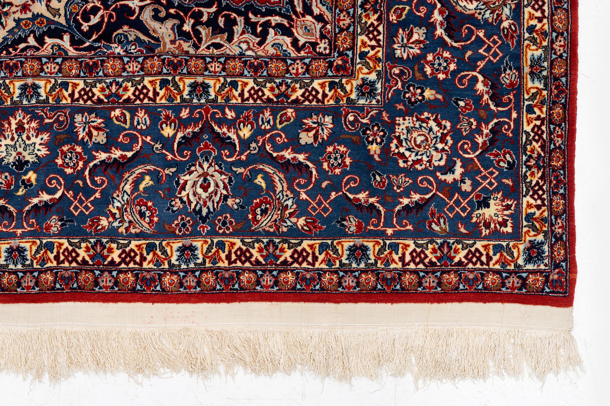 A semi-antique Isfahan carpet, Central Persia, signed (Ali) Seirafian, 328 x 250 cm.