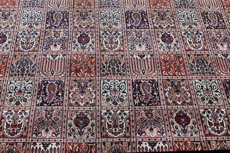 A part silk Ghom carpet, c. 346 x 251 cm.