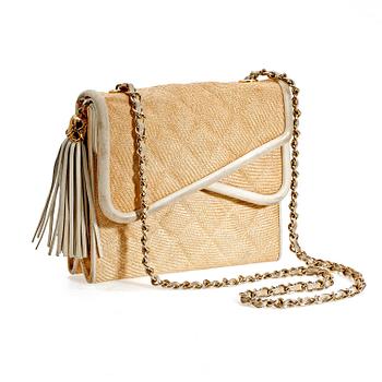 1216. A beige shoulder bag by Chanel.