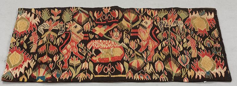 A carriage cushion, tapestry weave, "Lammet och fanan", ca 45-47 x 97,5-98 cm, Torna or Bara district,