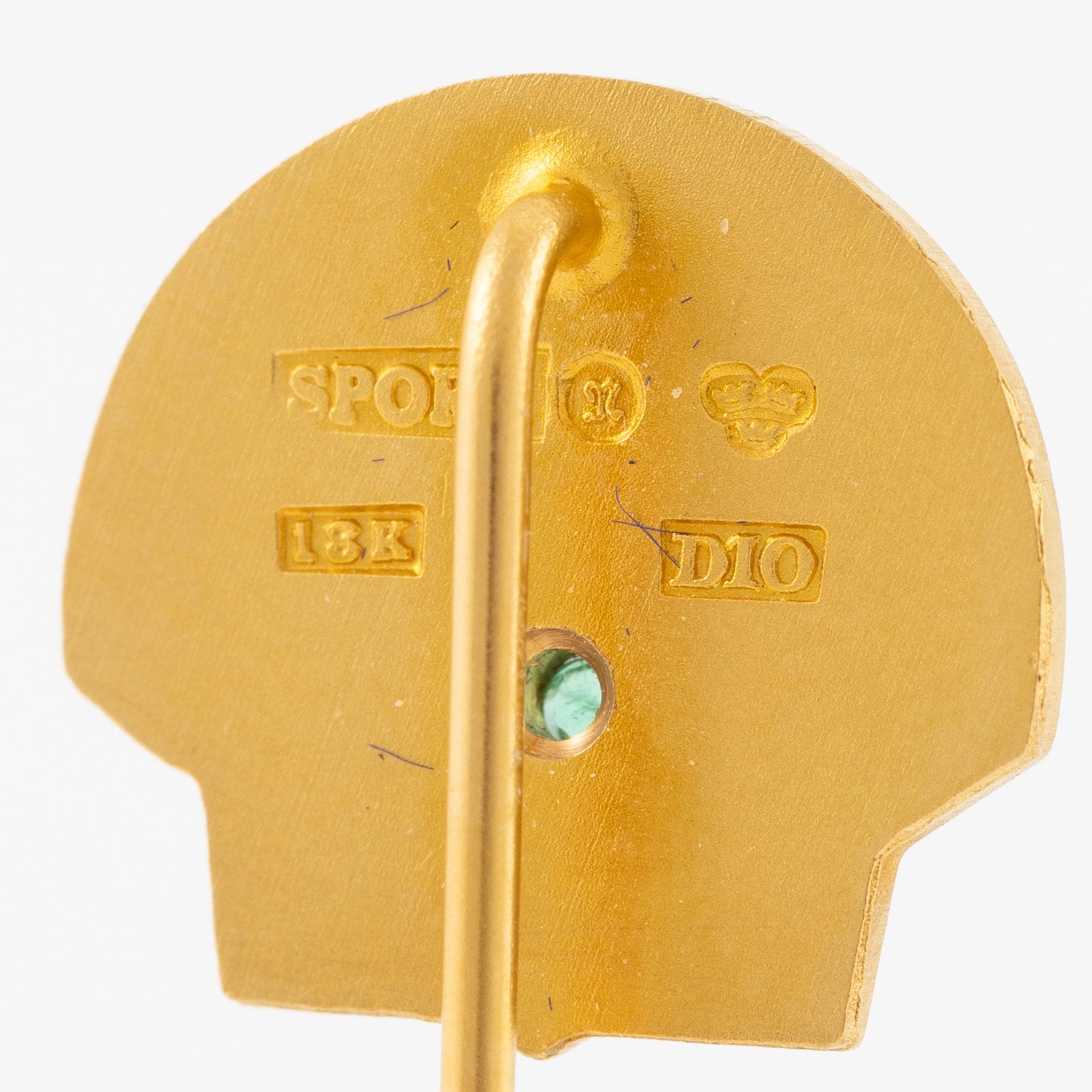 Slipsnålar, Sporrong,  ett par 18K guld med diamanter och grön sten.